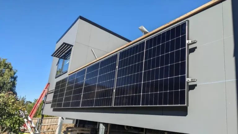Vertical wall-mounted solar panels on a modern Tasmanian home